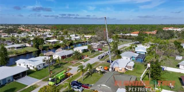 Crane used for planting a tree in Port Charlotte, FL.